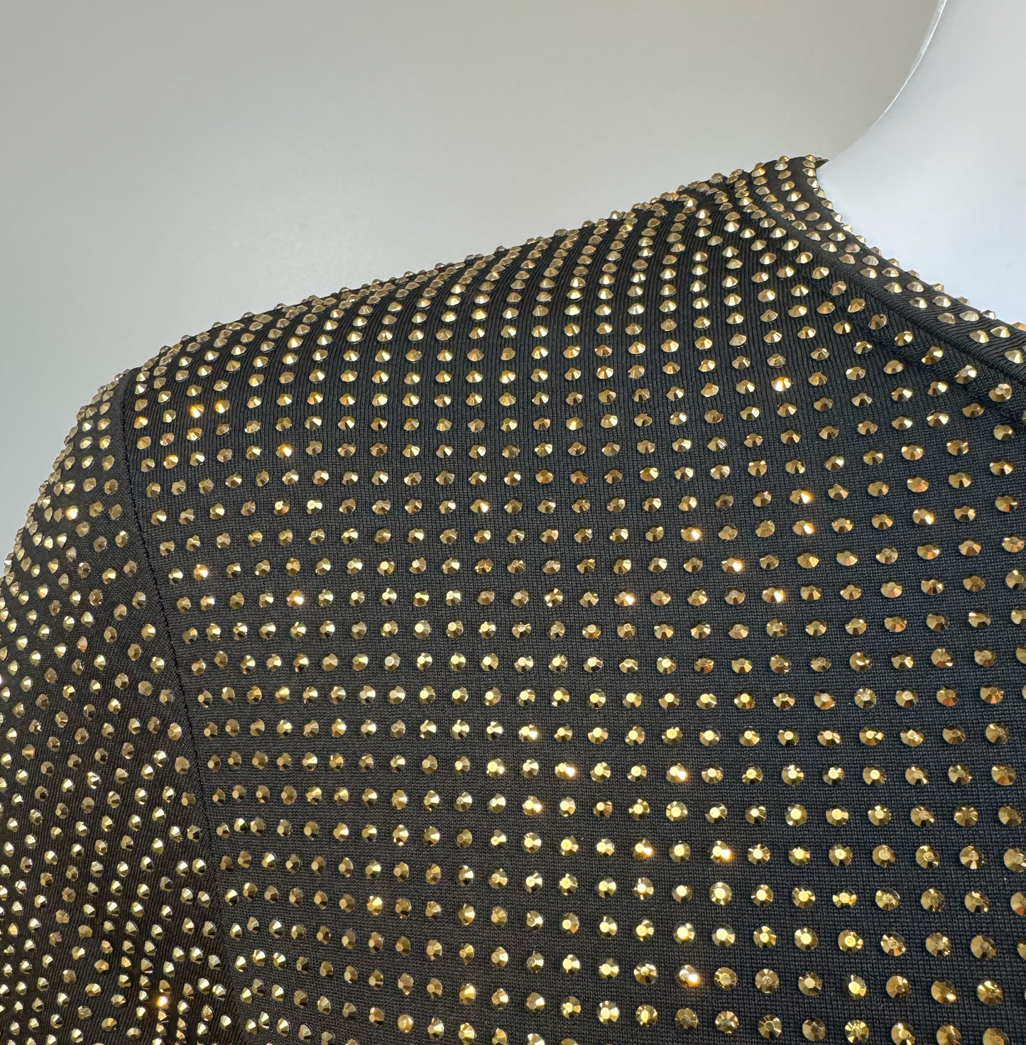 Shoulder detail of Gold Aurum Crystals on Black Fabric T-shirt revealing the impeccable construction of this complex garment.