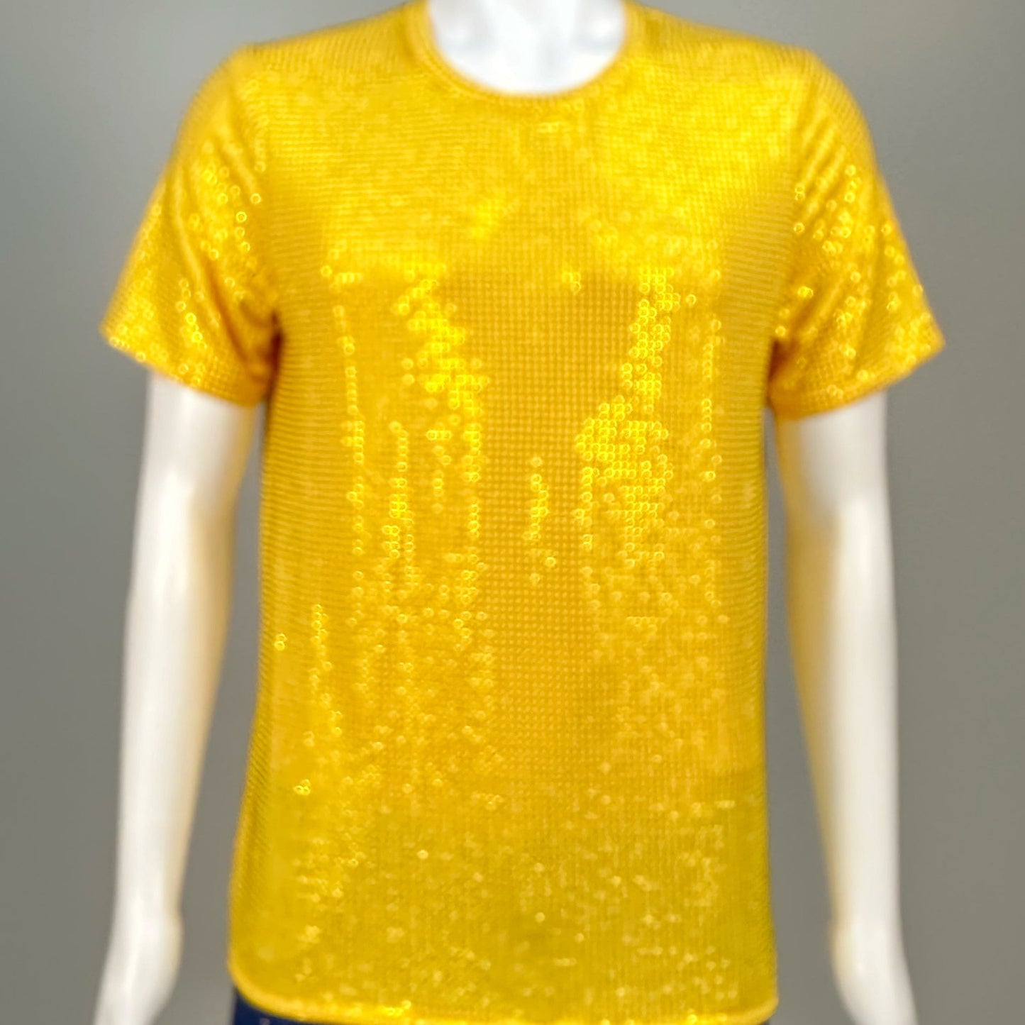 Blurred view of Yellow Crystals on Yellow Fabric T-shirt demonstrating how the garment sparkles in videos.