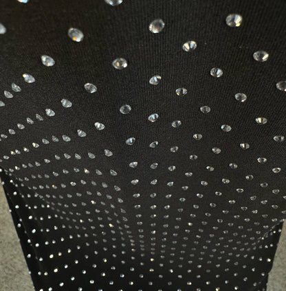 Looking down at Clear Crystals on Black Fabric Dotted T-shirt showing a close up of the rhinestone grid pattern and the sparkles as your focus shifts.