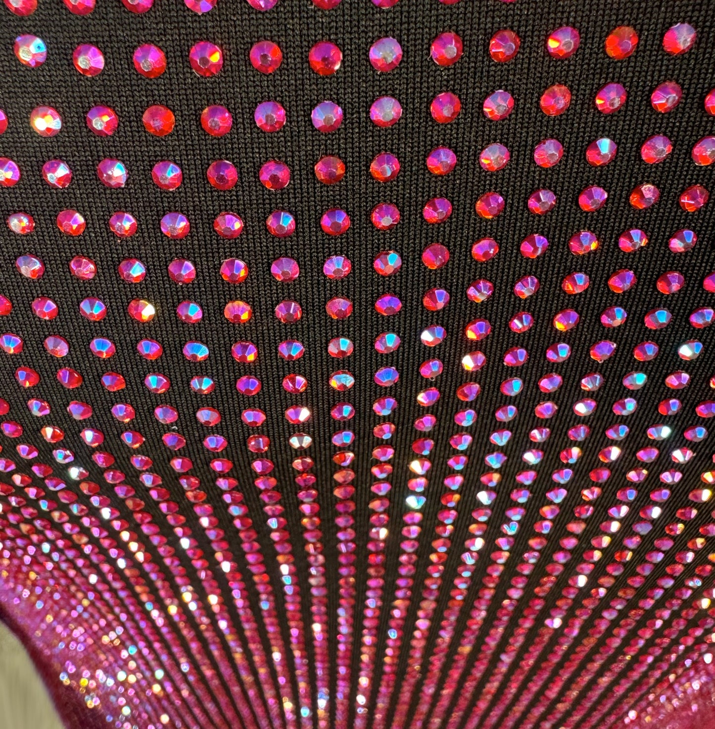 Looking down at Lt. Siam AB Crystals on Black Fabric T-shirt showing a close up of the rhinestone grid pattern and the sparkles as your focus shifts.