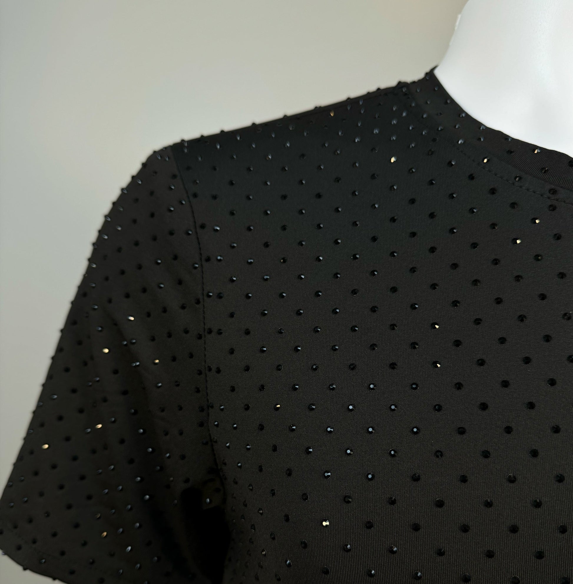 Shoulder detail of Jet Black Crystals on Black Fabric Dotted T-shirt revealing the impeccable construction of this complex garment.
