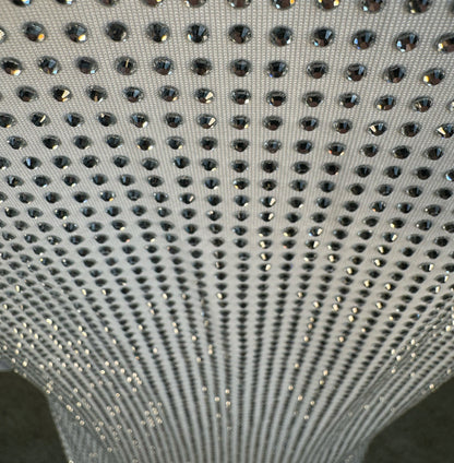 Looking down at Clear Crystals on White Fabric T-shirt showing a close up of the rhinestone grid pattern and the sparkles as your focus shifts.